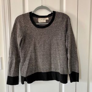 Grey with black trim warm sweater.
